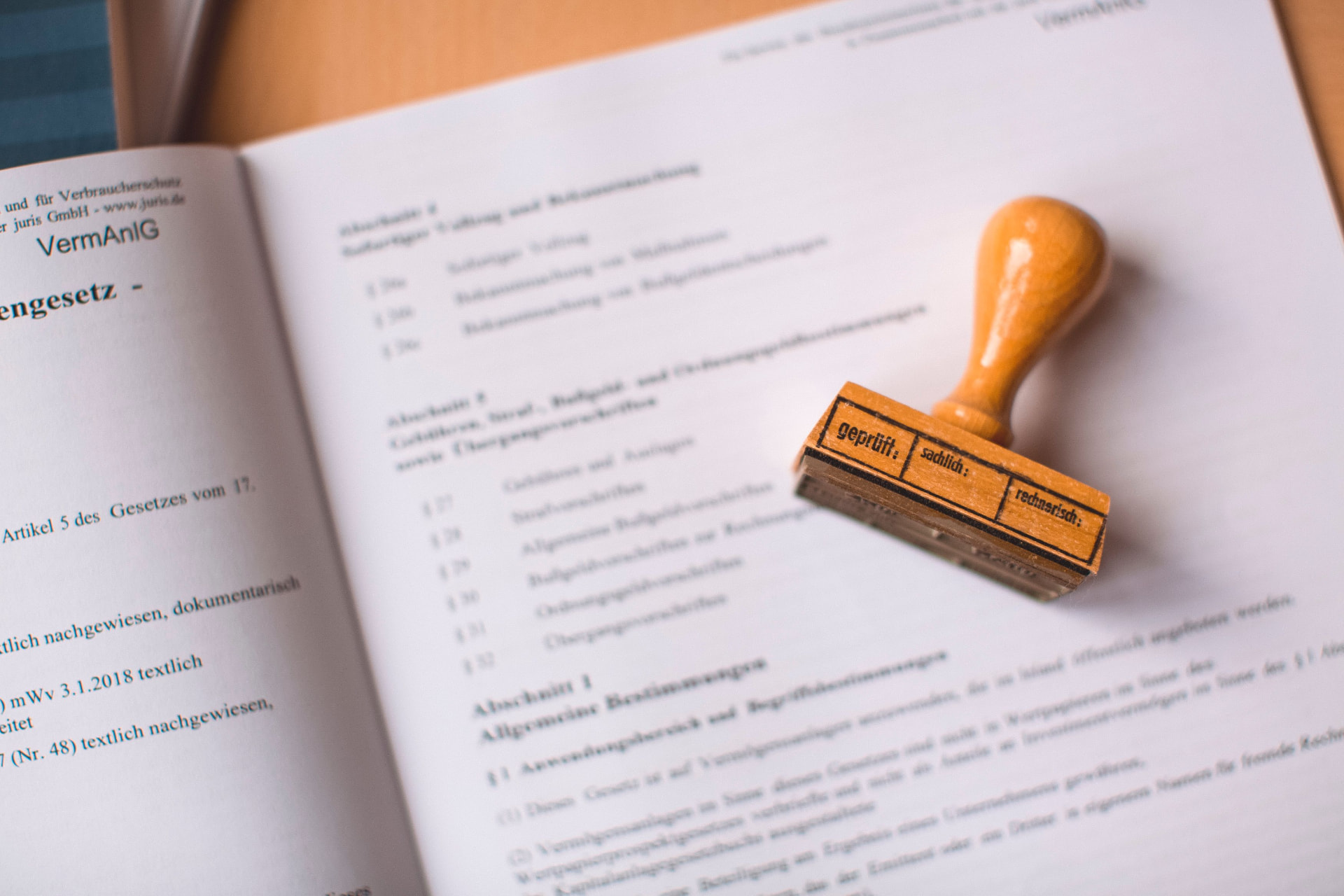 A verification stamp resting on an open law book